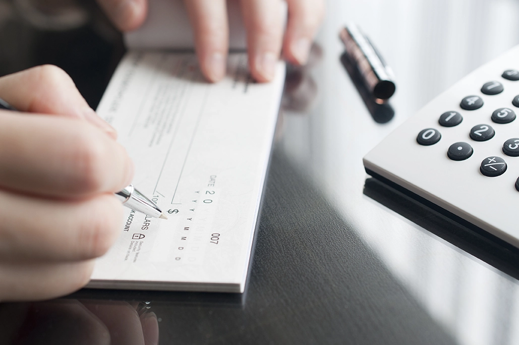 person writing a check