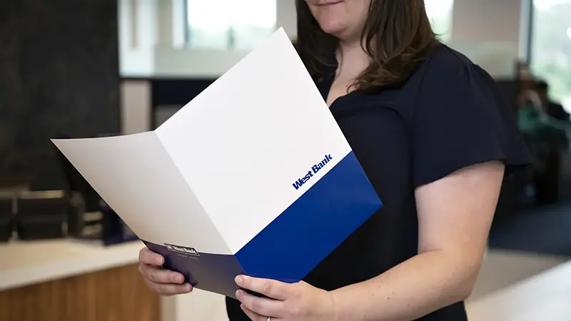 woman holding folder