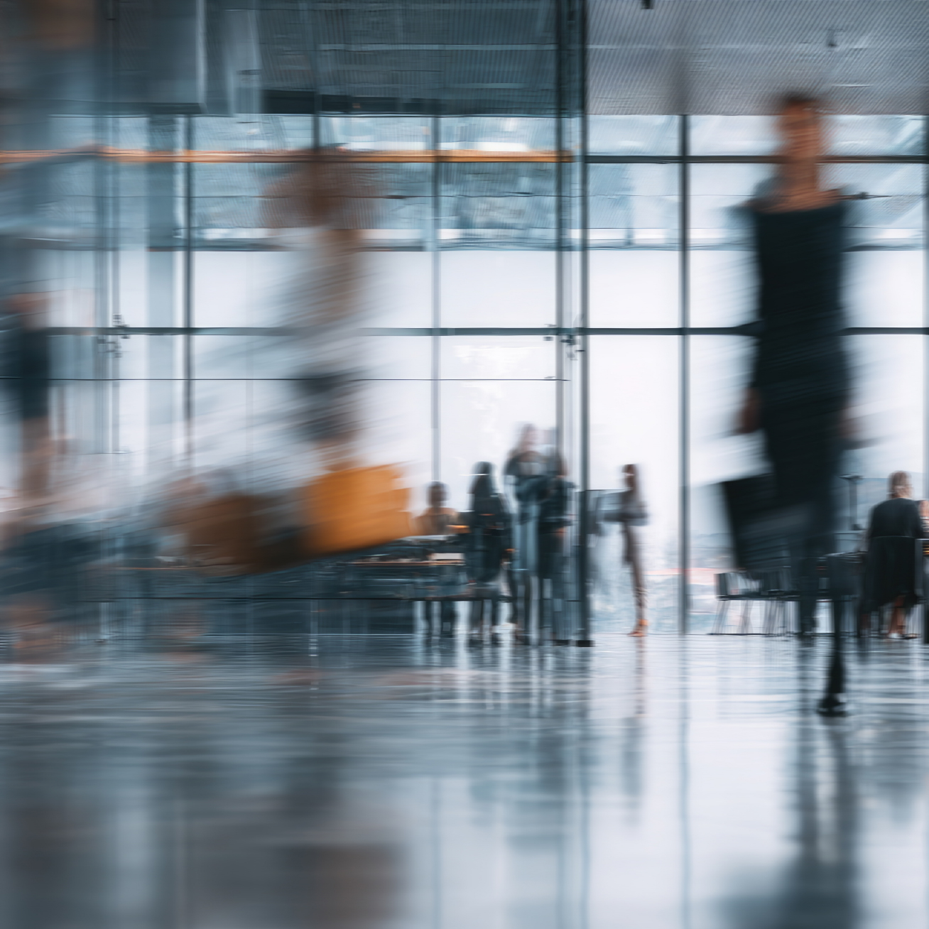 Blurred motion of people in an office